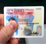 fake id card beingheld by reviewer